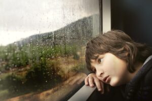little boy, window, waiting, bored, tired, rainy weather, glass window, raindrops, water droplets, wet, kid, child, inside, nature, train, looking out, boring, travel, rain, weather, water, droplets, sad